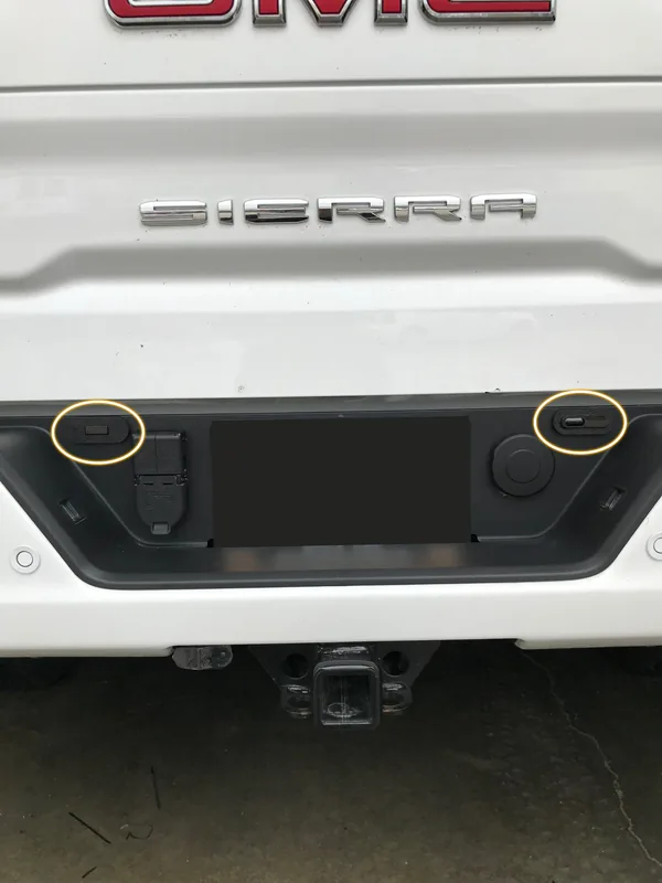 Dual laser shifter sensors mounted in the rear bumper of a GMC Sierra