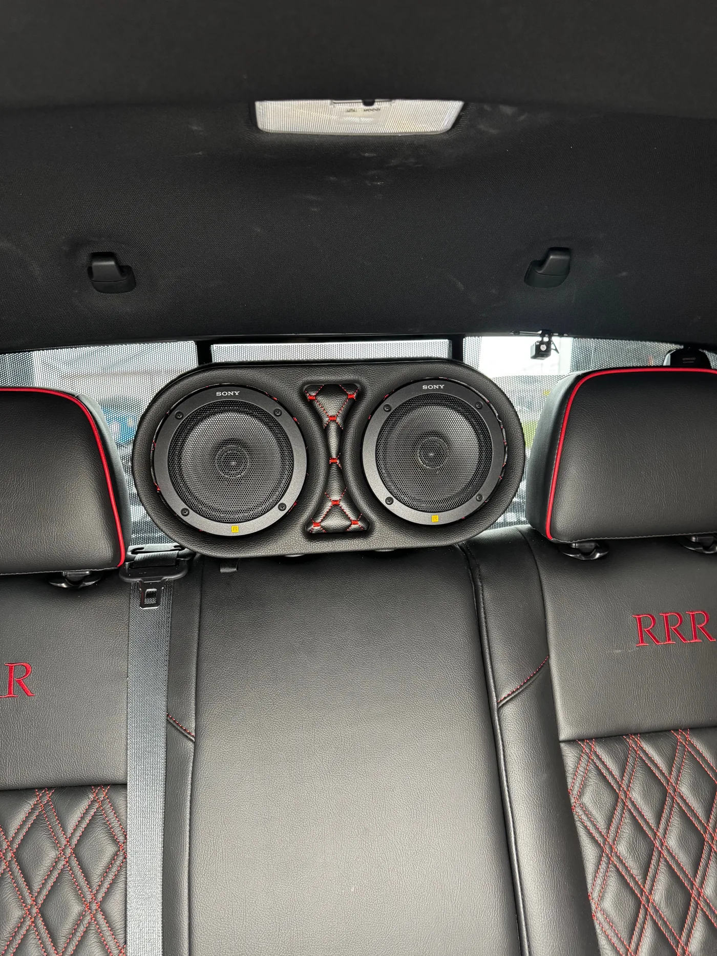 Custom rear-seat speaker pods with component speakers mounted, 2023 Toyota Tacoma
